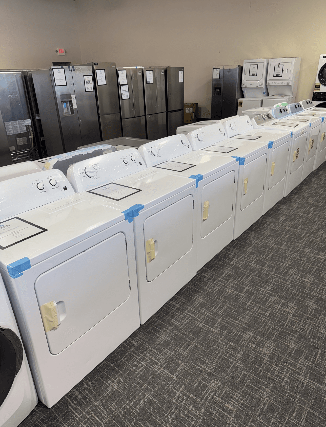 Wide selection of dryers and refrigerators on the showroom floor